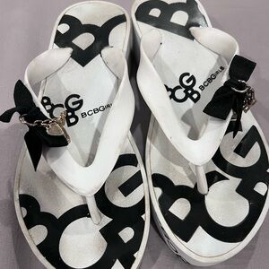 USED BCBGirls white and black sandals with charm